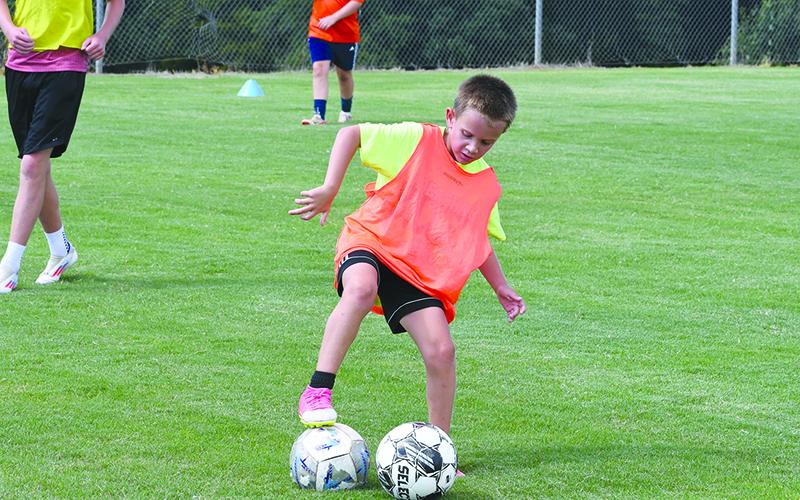 Jax Terrell saves a ball from going out of bounds. LANG STOREY/Staff