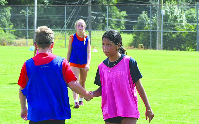 Yaretzi Romero shakes hands with the opponent after a camp scrimmage match. LANG STOREY/Staff