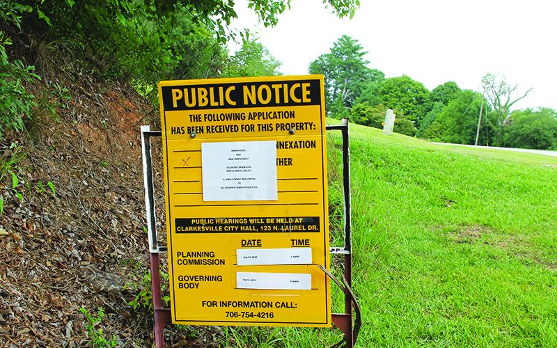 A sign marks the spot of the proposed Rocky Branch Road housing development in Clarkesville. The matter will be addressed at an Aug. 13 meeting. BRIAN WELLMEIER/Staff