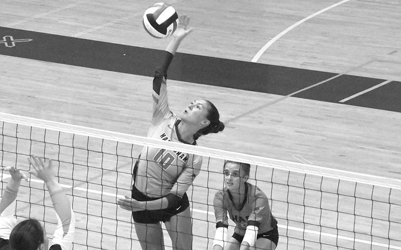 Ava Saxon makes a play at the net at White County on Tuesday. LANG STOREY/Staff