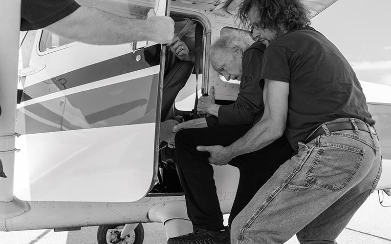 Local beekeeper Bob Ketch helps McNamara into the pilot’s seat of the Cessna 172A. ZACH TAYLOR/Staff