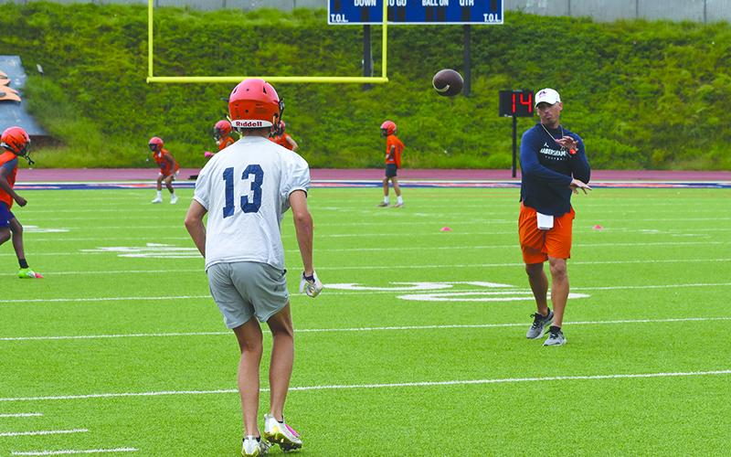 Coach Matt Shirley fires a pass to wide receiver  Drake Roland. LANG STOREY/Staff