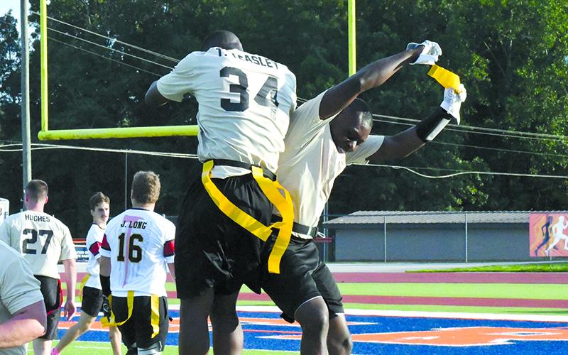 Tedarrius Teasley and Tomorea McGlockling of the Habersham-Banks team celebrate an interception Saturday. LANG STOREY/Staff