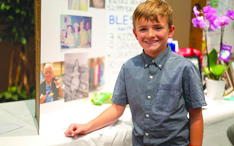 Joshua Bruce Gilpin, a great-great-grandson of Chastain, smiles proudly before the poster board filled with memories from the family. ZACH TAYLOR/Special