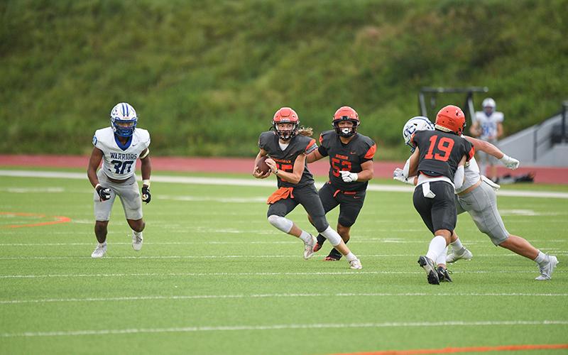 DJ Pass shows off his ability to scramble when need be. TOM ASKEW/Special
