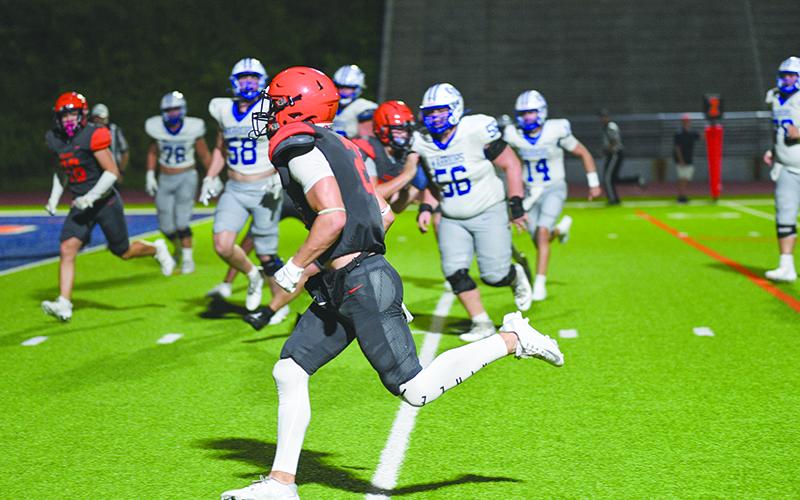 Landyn Savage takes an interception to the house for a Pick 6 against Oconee. TOM ASKEW/Special