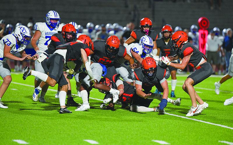 The Raider defense swarms a ballcarrier in the second half. TOM ASKEW/Special