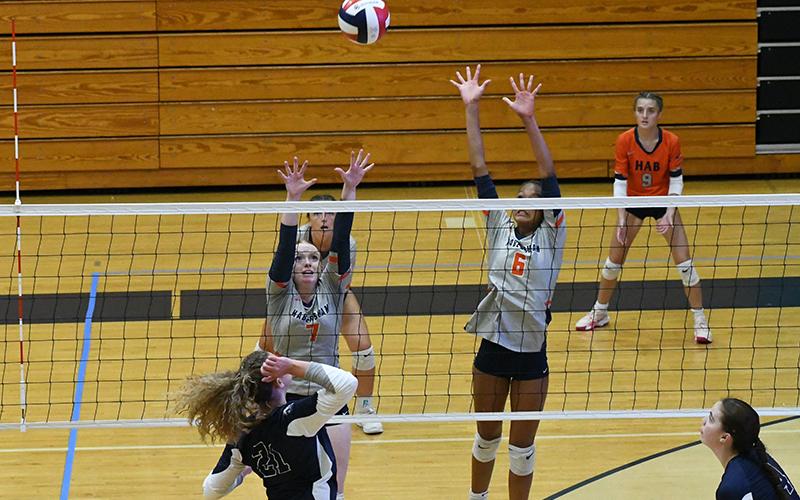Habersham’s Katelynn LuBuono (left) and McKenzie King go up for a block during a match last week. LANG STOREY/Staff