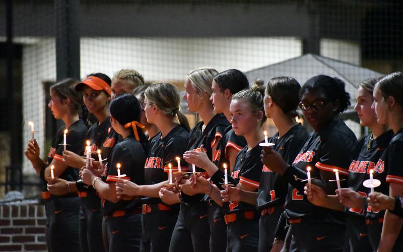 Habersham players partook in a candlelight vigil following the game Thursday night. LANG STOREY/Staff