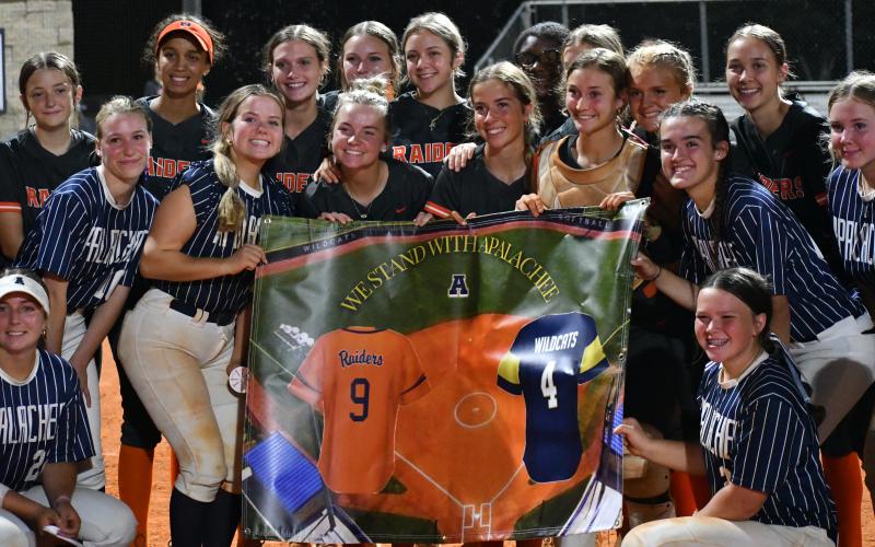 The Lady Raiders presented Apalachee with a banner after the game Thursday night. LANG STOREY/Staff