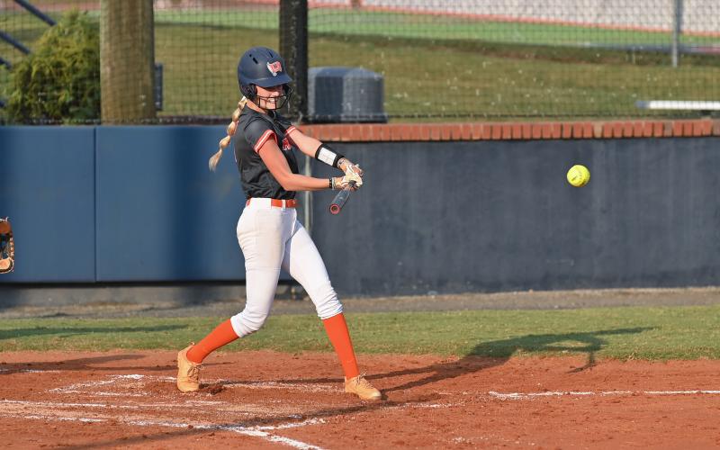 Karsen Wade rips a ball into play in HCHS' win over Winder-Barrow. TOM ASKEW/Special