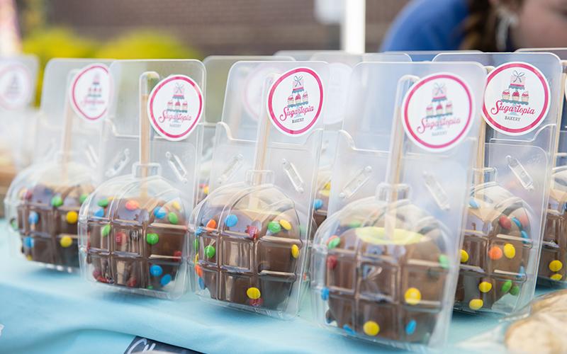 Sugartopia sells chocolate-covered apples with M&amp;Ms and apple pie nachos during Big Red Apple. ZACH TAYLOR/Staff