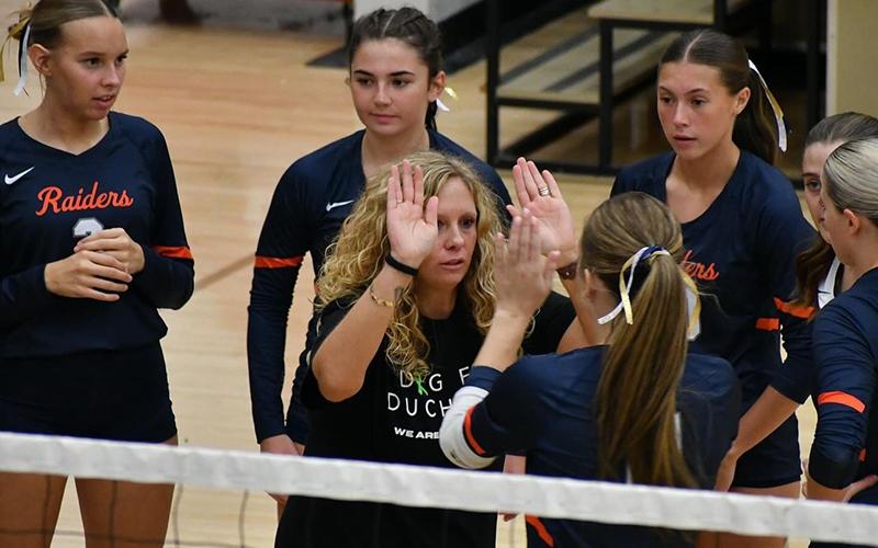 Coach Lindsay Herrin breaks things down for her team during a timeout earlier this season. LANG STOREY/Staff