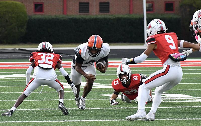 Donnie Warren slices through several Loganville defenders during Habersham’s dominant win Friday night. LANG STOREY/Staff