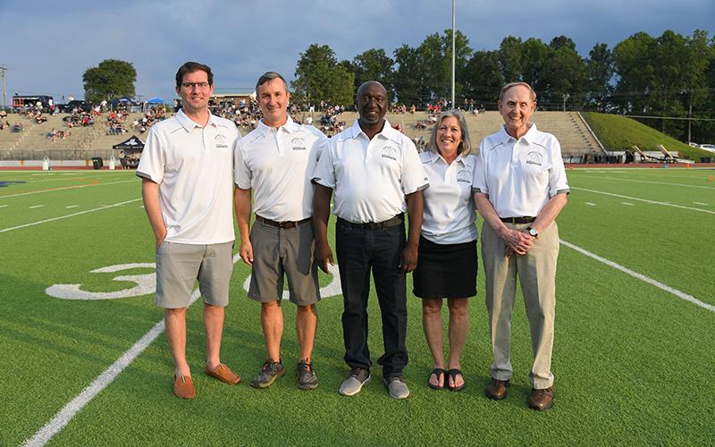 New HCHS Ring of Honor members Chet Sanders, Scooter Garrison, Roy Lee Williams, Terri Roberts and Herman Benfield were honored before kickoff Friday. TOM ASKEW/Special