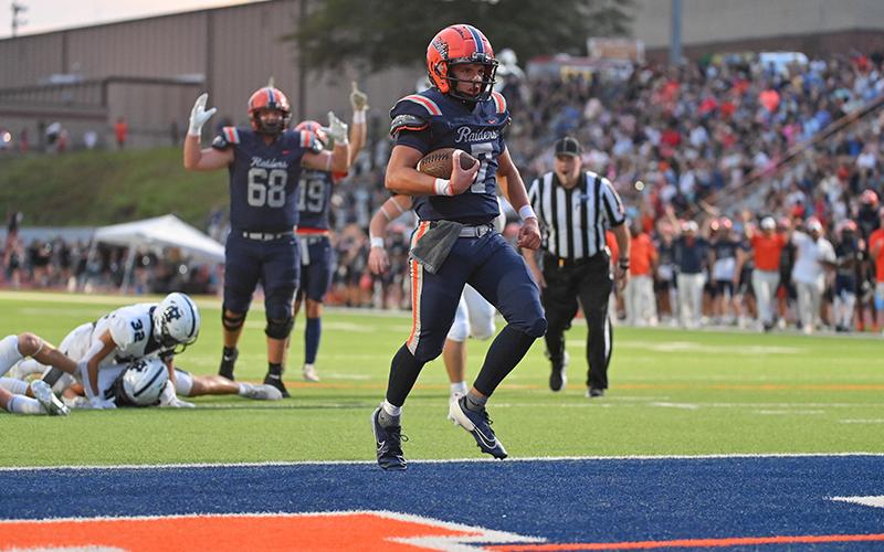 Raiders QB Paris Wilbanks takes it into the endzone early in the game Friday. TOM ASKEW/Special
