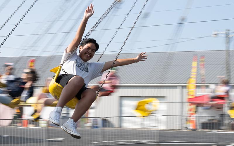 Lucky Tiamtisack goes round and round on the swings with his arms raised in the air. The special education day at the Chattahoochee Mountain Fair is an annual tradition in Habersham County. ZACH TAYLOR/Staff