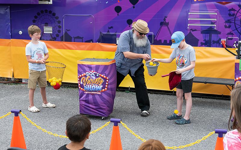 Alex Owen and Malachi Mooney participate in Doc’s Variety Show at the fair on Saturday. ZACH TAYLOR/Staff