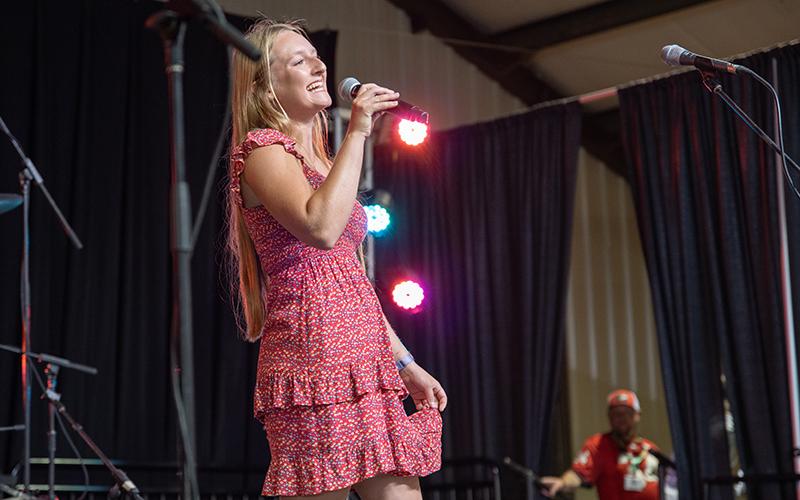 Oriana Rule gives her best hog call to the judges while trying not to take the competition too seriously. ZACH TAYLOR/Staff