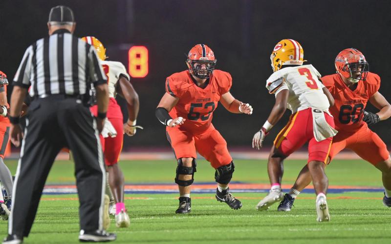 Dawson Barnett (No. 53) and the Raider O-line did their best to protect the pocket Friday. TOM ASKEW/Special