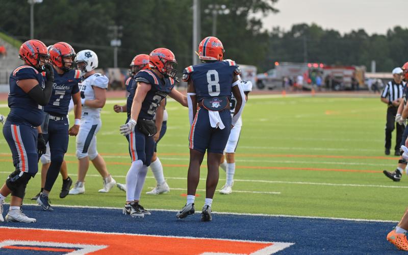 The Raider offense celebrates after Antonio Cantrell (No. 8) finds the endzone in a game earlier this season. TOM ASKEW/Special