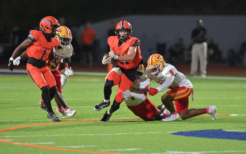 Habersham's Landyn Savage tries to escape a few Gladiators. TOM ASKEW/Special
