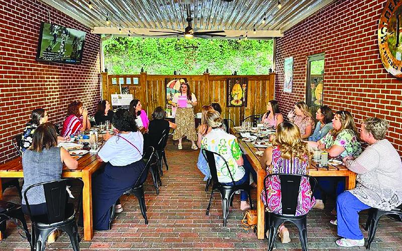 Marcia Hamil leads a discussion at a recent Habersham Professional Women meeting. SUBMITTED
