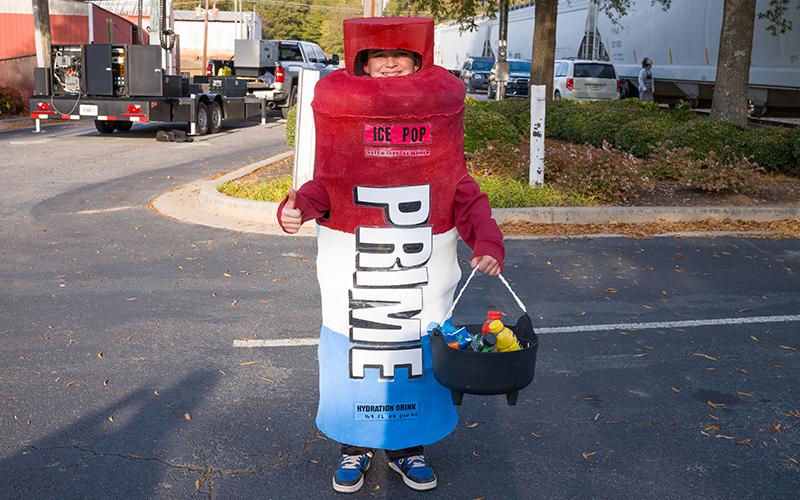 Hayden Jordan dresses as a Prime bottle and wins last year’s costume contest during the trick-or-treating in downtown Cornelia. ZACH TAYLOR/Staff