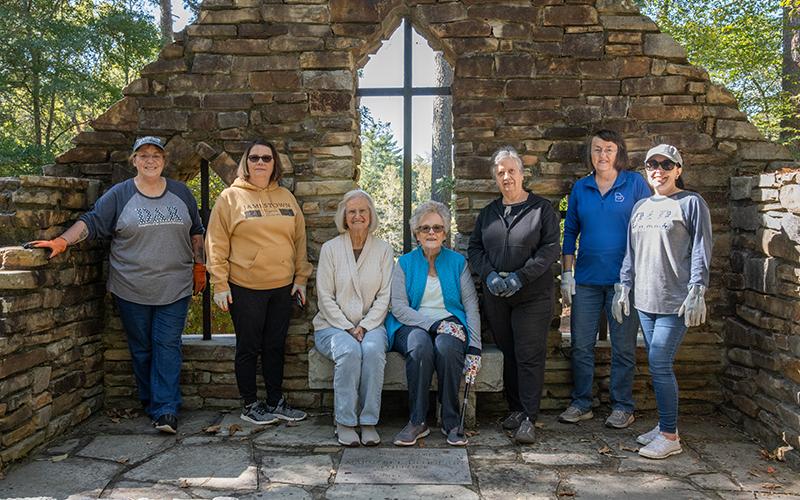 Lynn McCollum, Marcie Caudell, Polly Earle, Lynne Ramsaur, Gwen Ivester, Betty Massey and Tiffany Teoman pose for a picture at the Chapel of the Holy Cross Cemetery, otherwise known as the Kollock Cemetery on New Liberty Road. ZACH TAYLOR/Staff