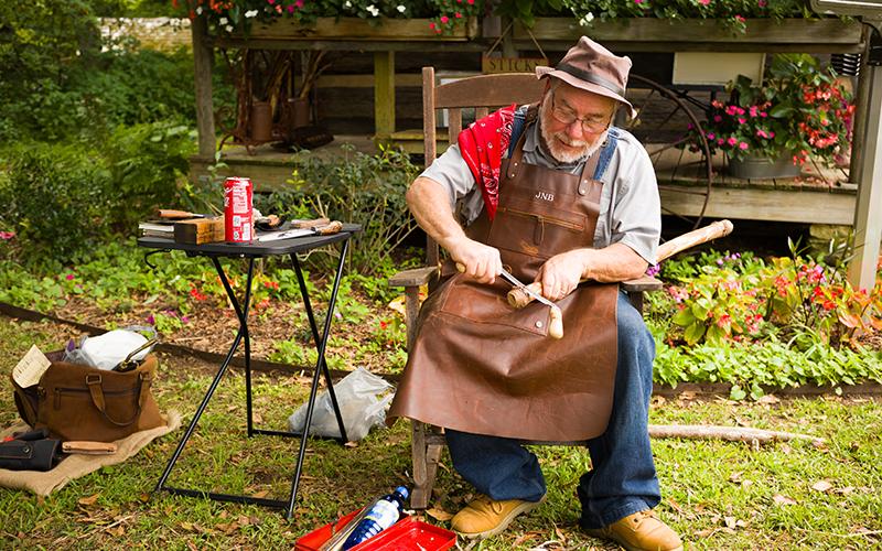 Jeff Blackwell carves into a cane during a previous event at the Mauldin House in Clarkesville. ZACH TAYLOR/Staff
