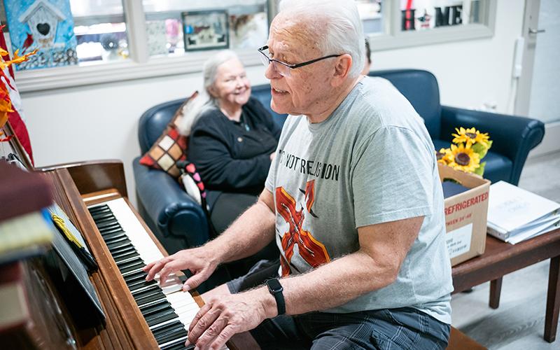 Michael Dunagan plays the keys at the Senior Center on Wednesday. The Senior Center is filled with song, games, and laughter on weekdays around lunchtime. ZACH TAYLOR/Staff