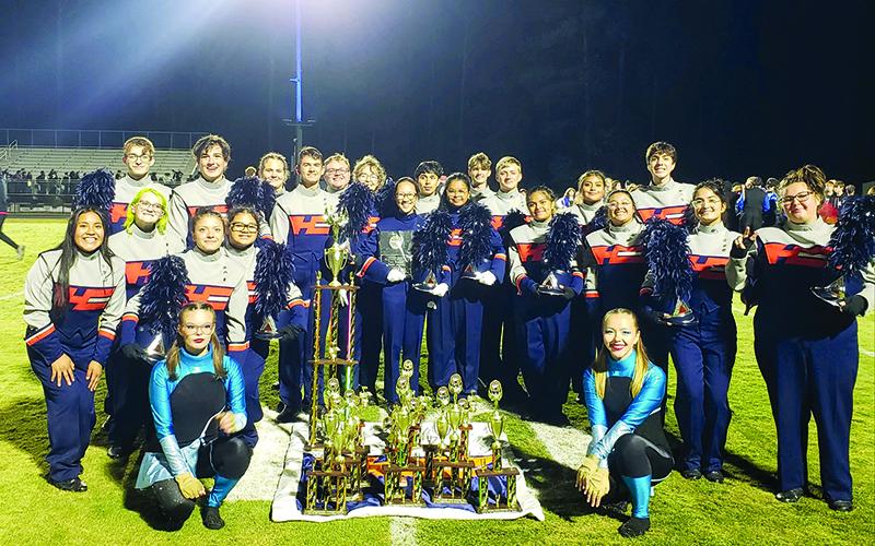 The Band of Blue stands with their hard-earned trophies at the Golden River Marching Festival on Oct. 19. SUBMITTED