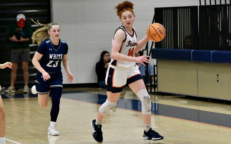 Daytona Underwood pushes up the floor during the first half of HCHS’ loss to White County Tuesday. LANG STOREY/Staff