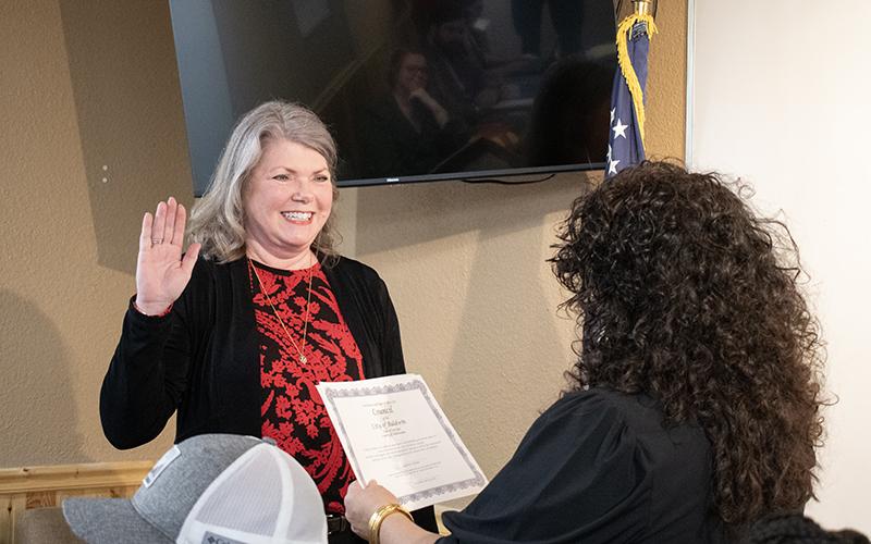 Nancy Lehman gets sworn into Baldwin City Council on Tuesday by Mayor Stephanie Almagno. JULIANNE AKERS/Staff