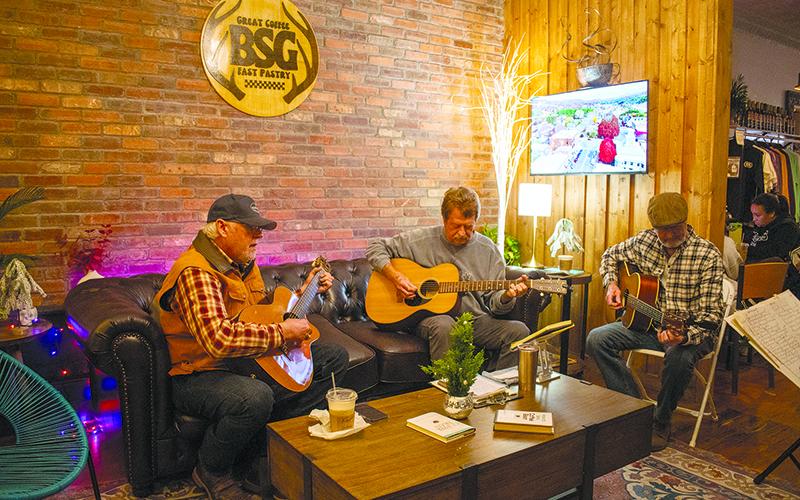 Alan Laney, David Green and Tim Green test out some new music at an acoustic circle at BSG Coffee &amp; Cafe on Thursday, Nov. 14. JULIANNE AKERS/Staff