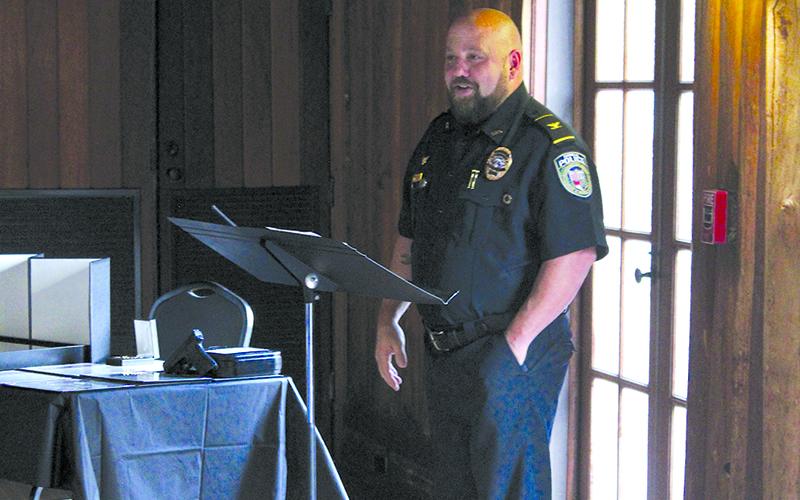 Cornelia Police Chief Jonathan Roberts details Sgt. Gunnels leadership during the celebration speech. HANNAH CAUDELL/Staff