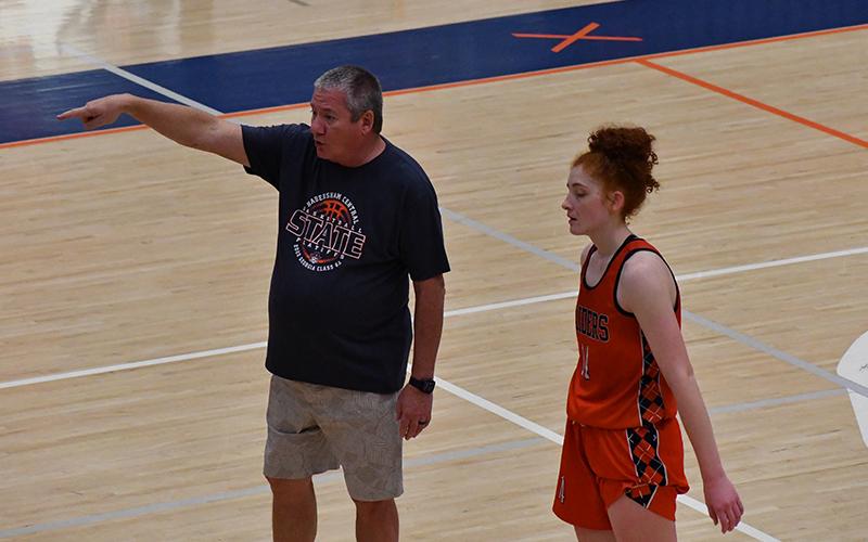 Lady Raiders Coach Bill Bradley yells out instructions during a recent practice as Daytona Underwood listens in. LANG STOREY/Staff