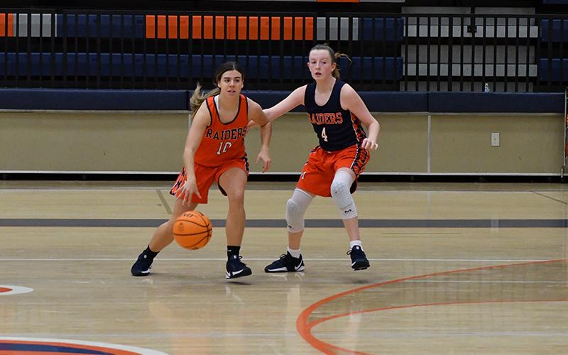 Katie Roberts (No. 10) attacks the key during scrimmage action at a Lady Raiders practice. LANG STOREY/Staff