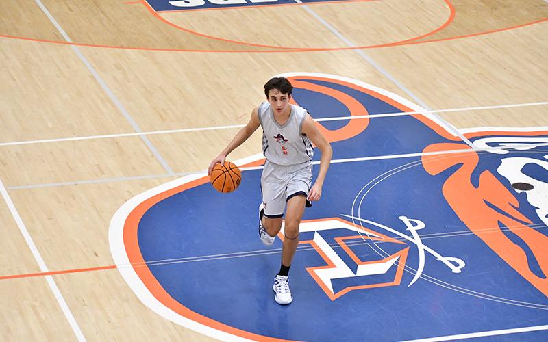 Habersham’s Jake Mihalik drives the ball up the floor during practice earlier this week. LANG STOREY/Staff
