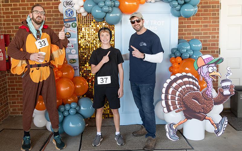 The winner of this year’s Turkey Trot, Jackson Weeks, finished with a time of 20:54, an impressive feat for the youngster battling the hilly route. Weeks stands in between Zach Staggs and Pastor Nathan LaShoto in this photo. ZACH TAYLOR/Staff