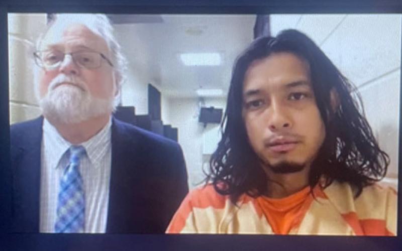 Angel DeJesus Rivera-Sanchez (right) appears with Public Defender Drew Powell in Habersham County Magistrate Court on Nov. 1 in this video screenshot.