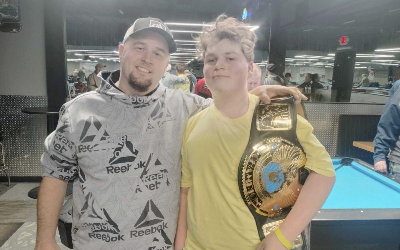Colston Harrelson (right) and his father Bradley snap a photo after Colston’s big win this past weekend in Alabama. SUBMITTED