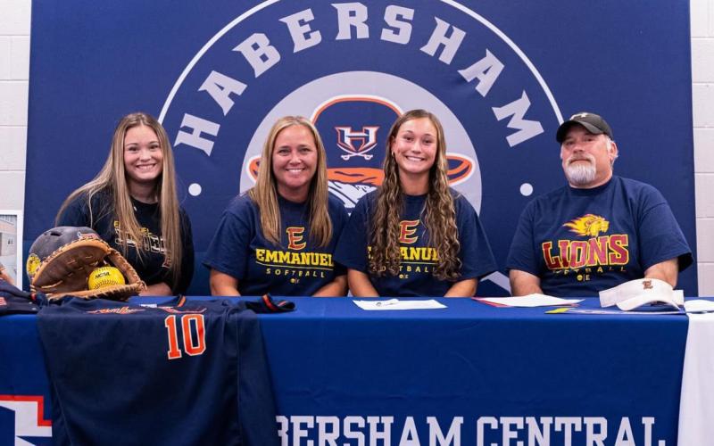 Shelby Rinefierd celebrated her commitment with family including sister Shyanne, mom Jennifer, and dad TJ. SUBMITTED