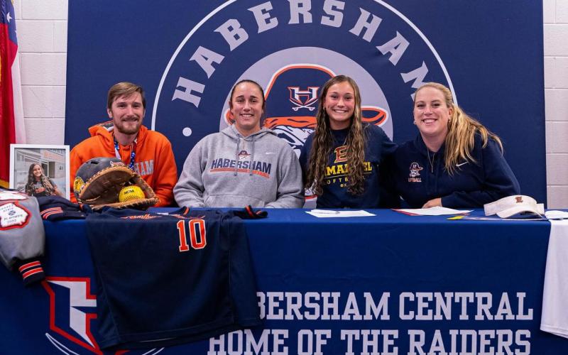 Assistant Coach Adam Banks, Head Coach Karly Thompson, Shelby Rinefierd and Assistant Coach Ansley Patrum were all smiles at Rinefierd’s signing. SUBMITTED