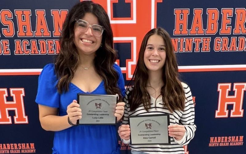 JV cheerleaders Lucy Letis (left) and Alex Carroll were honored for their outstanding leadership at the Hab Central competition cheer banquet earlier this week. SUBMITTED