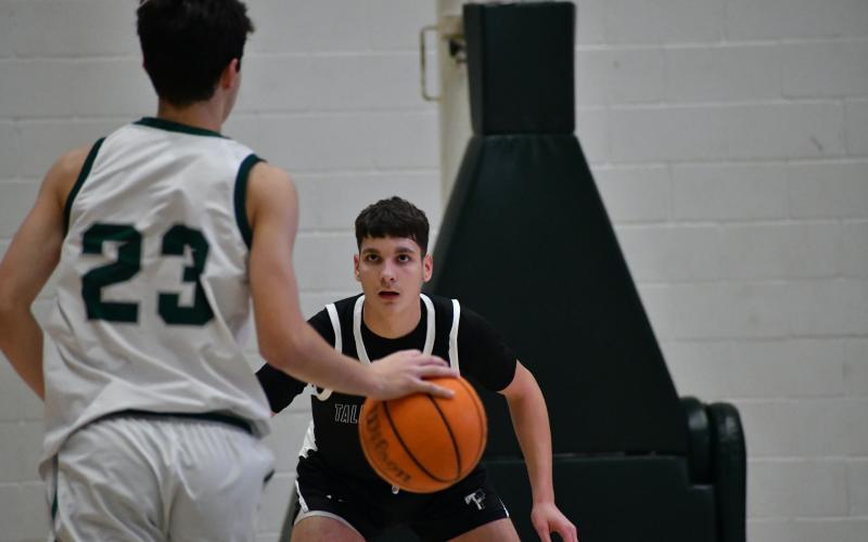 TFS sophomore forward Todor Stanimirovic clamps down on defense during the Indians win over Athens Academy Saturday. LANG STOREY/Staff