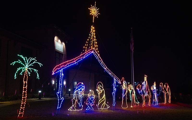 An illuminated manger scene sits outside of Cornelia City Hall. ZACH TAYLOR/Staff