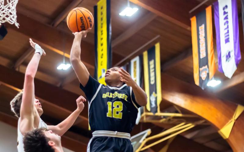 9086: Malachi Dooley polishes off a bucket during a contest earlier this season. BEN SCHICK/Oglethorpe Athletics