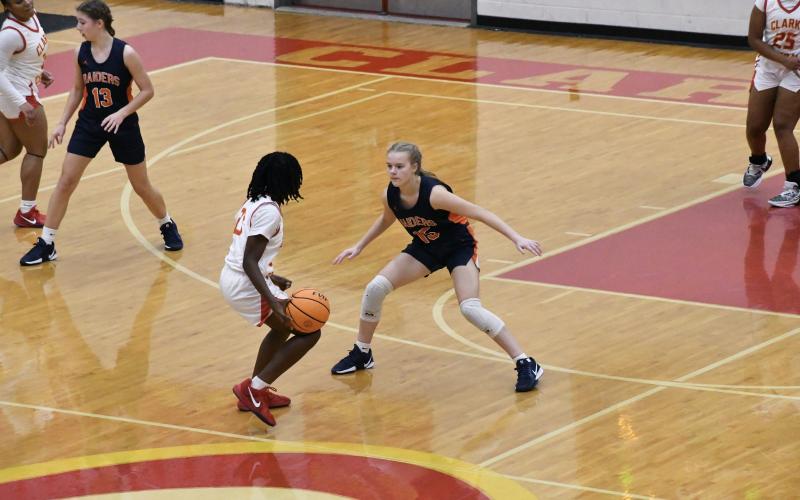 HCHS' Macy Huff locks down on defense during the first half of the Lady Raiders game at Clarke Central Thursday. LANG STOREY/Staff