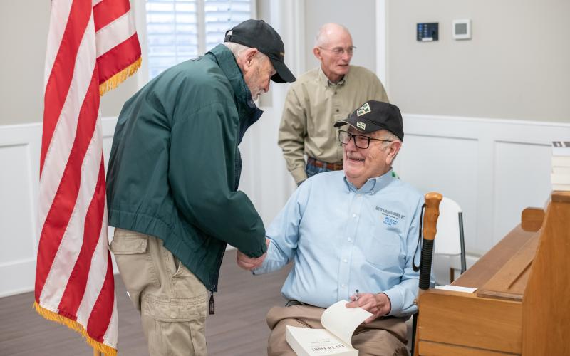 Jerry Lewis (left) shakes hands with Vietnam veteran Bob Babcock after the keynote address. ZACH TAYLOR/Staff